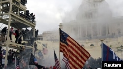 FILE - Supporters of U.S. President Donald Trump protest in front of the U.S. Capitol in Washington, Jan. 6, 2021. 