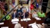 President Barack Obama talks during his meeting with small-business owners and members of Congress to discuss the importance of the reauthorization of the Export-Import Bank in the Roosevelt Room of the White House in Washington, July 22, 2015.