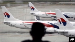 FILE - A fleet of Malaysia Airline planes is seen on the tarmac of the Kuala Lumpur International Airport, in Malaysia, Jan. 29, 2015.