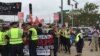 First clash with police - stopped counter-protestors because of picket signs