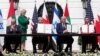 Israeli Prime Minister Benjamin Netanyahu, left, President Donald Trump, Bahrain Foreign Minister Khalid bin Ahmed Al Khalifa and United Arab Emirates Foreign Minister Abdullah bin Zayed al-Nahyan gather at the White House, Sept. 15, 2020.