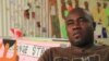 Kenyan artist Michael Soi at his Nairobi studio. 