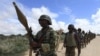 FILE - African Union Mission in Somalia (AMISOM) soldiers from Burundi patrol on the outskirts of Mogadishu, Somalia, May 22, 2012.