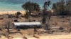 FILE - In this photo provided by the Australian Defense Force, debris from damaged building and trees are strewn around on Atata Island in Tonga on Jan. 28, 2022, following the eruption of an underwater volcano and subsequent tsunami.