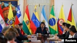 Venezuela's President Nicolas Maduro speaks to the Union of South American Nations' (UNASUR) foreign ministers at Miraflores palace in Caracas, March 25, 2014