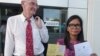 FILE - Alan Morison of Australia, editor of The English-language news website Phuketwan, left, and his Thai colleague, Chutima Sidasathien, right, walk out during a break at Phuket provincial courtroom in Phuket, southern Thailand, Apr. 17, 2014.