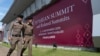 In this Tuesday, Oct. 29, 2019. Thai policemen walk in front of a banner welcoming Association of Southeast Asian Nations at the venue of The 35th annual Association of Southeast Asian Nations (ASEAN) in Nonthaburi province, Thailand. U.S. national…