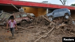 A man walks among the ruins after flooding and mudslides in Mocoa, Colombia, April 2, 2017.