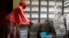 An administration municipal worker prepares ballot boxes before distributing them to the polling station for Sunday's presidential election in Yaounde, Cameroon Oct. 5, 2018. 