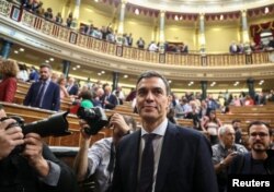 FILE - Spain's Prime Minister and Socialist party (PSOE) leader Pedro Sanchez stands in the chamber in Madrid, Spain, June 1, 2018.
