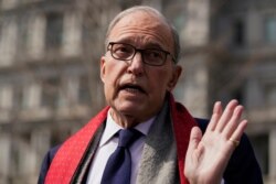 FILE - White House chief economic adviser Larry Kudlow talks to reporters about the economic impact of the coronavirus, at the White House, March 16, 2020, in Washington.