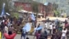 FILE - Protesters wave Ambazonian flags at a roadblock in the English-speaking city of Bamenda, Cameroon, Oct. 1, 2017. Ambazonia is a self-declared state consisting of the Anglophone portions of Cameroon.