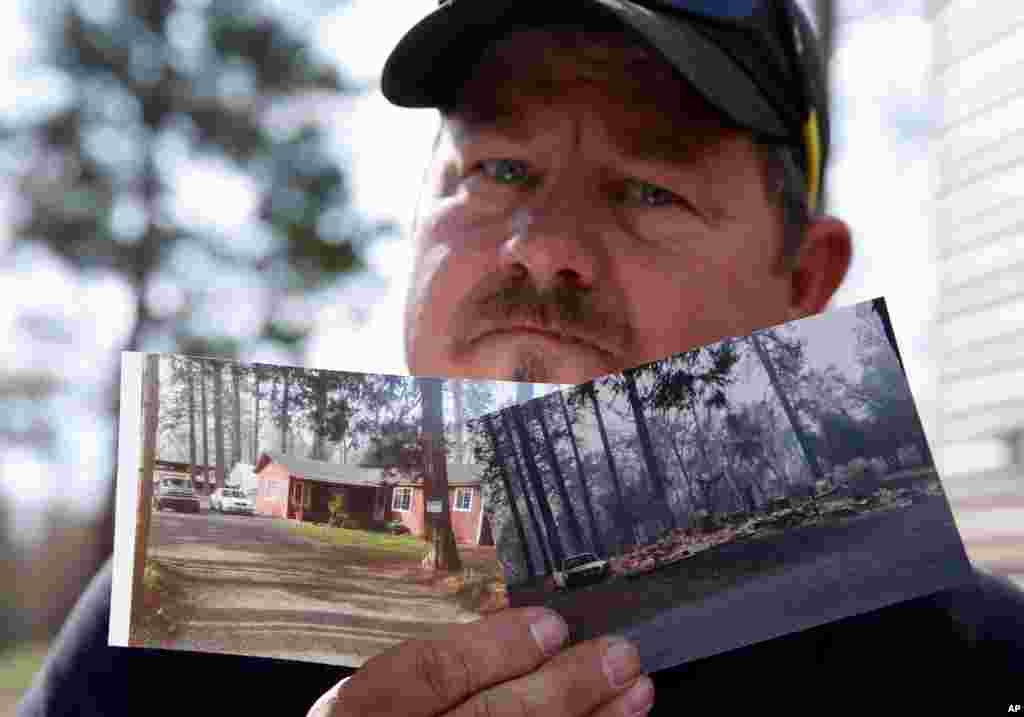 Bill Husa displays before-and-after photos of his home, Oct. 24, 2019, lost in last year&#39;s Camp Fire in Paradise, Calif. Husa&#39;s home is one of nearly 9,000 Paradise homes destroyed in the deadliest and most destructive wildfire in California history. 
