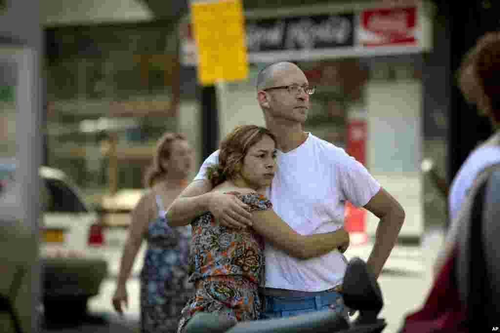 Israelis looks at a site where remnants of a long-range rocket fired by Palestinians militants from Gaza landed after being shot down by Israel’s "Iron Dome," in Tel Aviv, July 10, 2014.
