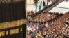 Workers arrive with a police escort to replace the Kiswa (silk cloth covering the Kaaba) at the Grand Mosque in Mecca, Saudi Arabia, July 6, 2024. S(audi Press Agency/Handout)