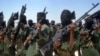 FILE - Islamist fighters loyal to al-Shabab perform military drills at a village in the Lower Shabelle region, 25 kilometers outside Mogadishu, Feb. 17, 2011. 