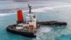 Une vue aérienne prise à Maurice le 17 août 2020 montre le vraquier MV Wakashio, appartenant à une société japonaise mais battant pavillon panaméen, qui s'était échoué et s'était brisé en deux près du parc marin de Blue Bay.