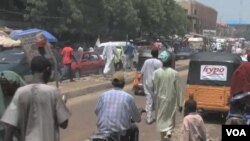 Mutane da babura a birnin Kano, dake arewacin Najeria. 