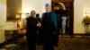 Afghanistan's President Hamid Karzai (R) shakes hands with his Indian counterpart Pranab Mukherjee ahead of their meeting at the presidential palace in New Delhi, India, May 21, 2013. 