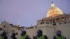 In this Jan. 6, 2021, photo, police form a line to guard the Capitol after violent rioters stormed the Capitol, in Washington.