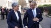 Britain's Foreign Secretary James Cleverly welcomes Australian Minister for Foreign Affairs Penny Wong, left, at Carlton Gardens in London, ahead of their bilateral meeting, Feb. 1, 2023.