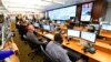 FILE - Personnel at the The Centers for Disease Control and Prevention (CDC) work the Emergency Operations Center in response to the coronavirus, among other threats, Feb. 13, 2020, in Atlanta, Georgia.
