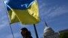 Activists wave the Ukrainian flag outside the US Capitol in Washington, DC, on April 23, 2024.