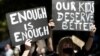 FILE - Thousands of people with placards and banners rally demanding justice for women in Sydney, Monday, March 15, 2021, as the government reeled from two separate allegations. The rally was one of several across Australia.