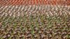 FILE - Members of Iran's Revolutionary Guard march in front of the mausoleum of the late revolutionary founder Ayatollah Khomeini outside Tehran, Sept. 2014.