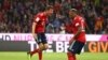 Thomas Mueller, à gauche, jubile après son premier but avec Jerome Boateng, lors d’un match de la bundesliga, 24 août 2018 