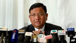 Philippines Secretary to the Cabinet Jose Rene Almendras speaks during a press conference at the Philippine Embassy in Hong Kong, April 23, 2014.