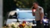A bouquet left by mourners lies near the site of Wednesday's mass shooting in Thousand Oaks, Calif., Nov. 9, 2018. 