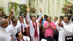 A scion of Sri Lanka’s Rajapaksa family, presidential candidate Namal Rajapaksa, center, gestures as he receives ticket from the Sri Lanka Podujana Peramuna (SLPP) party in Colombo on Aug. 7, 2024.