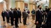 FILE - Democratic House impeachment managers stand before entering the Senate Chamber as they deliver to the Senate the article of impeachment alleging incitement of insurrection against former President Donald Trump, in Washington, Jan. 25, 2021.