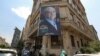 A campaign banner for reformist presidential candidate Masoud Pezeshkian hangs along the facade of a building in Tehran, Iran, on June 26, 2024. Former President Hassan Rouhani endorsed Pezeshkian two days before the election is to take place.