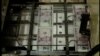 US Fed Ends Bond Buying Program, Keeps Interest Rates Low