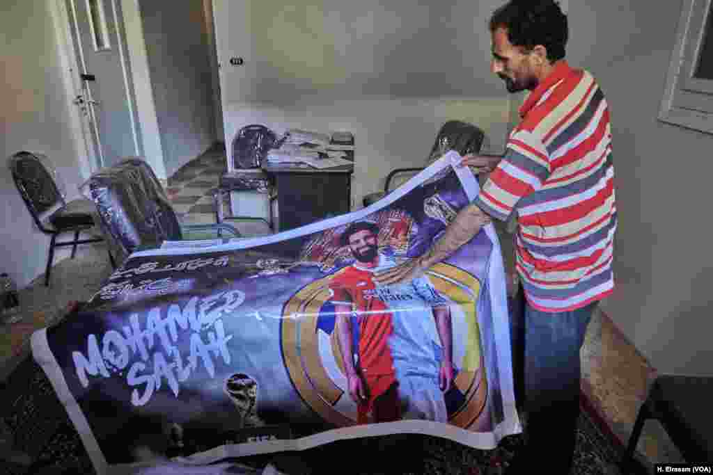 Hassan Bakr lays out a poster featuring Nagrig's most famous son.