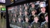 FILE - A TV screen shows file images of North Korean soldiers during a news program at Seoul Railway Station in Seoul, South Korea, Oct. 18, 2024. 