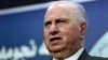 FILE - Ahmad Chalabi speaks to the media in Baghdad.