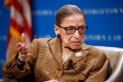 FILE - U.S. Supreme Court Justice Ruth Bader Ginsburg speaks during a discussion on the 100th anniversary of the ratification of the 19th Amendment at Georgetown University Law Center in Washington, Feb. 10, 2020.