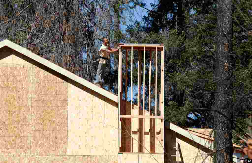 A home is rebuilt, Oct. 18, 2019, after the last year&#39;s Camp Fire in Paradise, Calif., Only a handful of homes have been rebuilt in the community that lost nearly 9,000 residences in last year&#39;s Camp Fire.