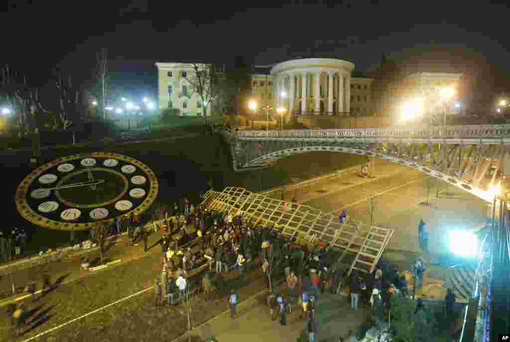 Protesters stand on a barricade in Independence Square in Kyiv, Dec. 2, 2013.