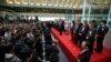Japanese Prime Minister Shinzo Abe (C) on the podium, speaks during a ceremony to wrap up the year's trading on the Tokyo Stock Exchange in Tokyo, Dec. 30, 2013.
