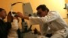 FILE - A doctor performs laser microsurgery on a 2-year-old with congenital cataracts at the Ophthalmology Institute in La Paz, Bolivia, April 26, 2006. Researchers now have discovered a technique that removes the cataracts, and stimulates a child's stem cells to regrow a functioning lens.
