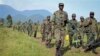 Congolese army soldiers on a reconnaissance mission near Kibumba Hill, around 25km from the provincial capital Goma, in eastern Congo Sunday, Oct. 27, 2013. (AP Photo/Joseph Kay)