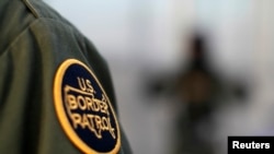 FILE - A logo patch is shown on the uniform of a U.S. Border Patrol agent.