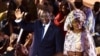 Le président sortant Macky Sall (à gauche) et son épouse Marieme Faye Sall (à droite) saluent les spectateurs à la cérémonie de son investiture comme candidat à la prochaine élection présidentielle, à Dakar, le 1er décembre 2018,
