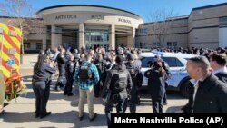 Emergency personnel gather outside Antioch High School after a shooting, in Nashville, Tennessee, Jan. 22, 2025.