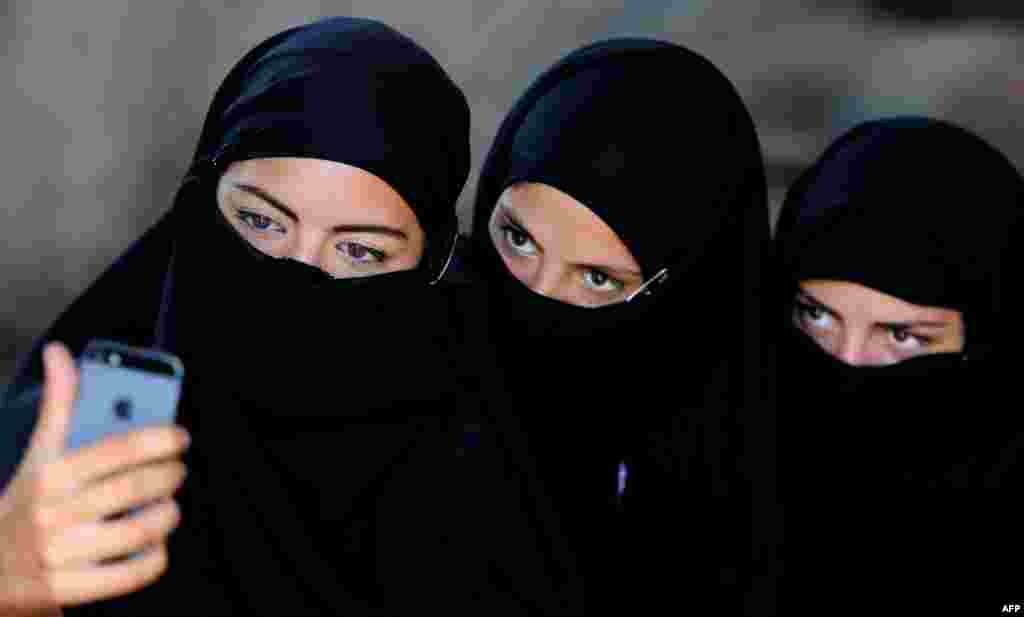 Georgian actors take a group selfie wearing veils before taking part in a joint Georgian-U.S. military counterterrorism exercise called "Agile Spirit 2014" at the Vaziani military base outside Tbilisi.