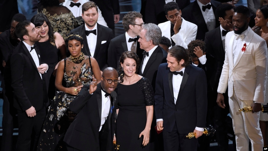 Barry Jenkins, foreground left, and the cast accept the award for best picture for "Moonlight" at the Oscars on Sunday, Feb. 26, 2017, at the Dolby Theatre in Los Angeles. (Photo by Chris Pizzello/Invision/AP)